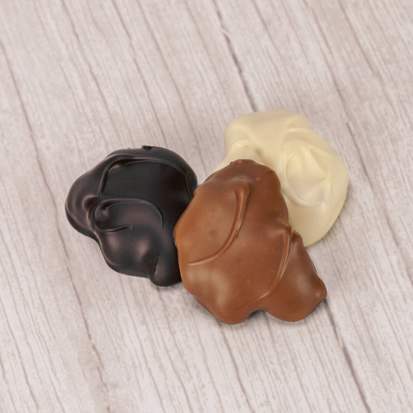  tur'Kins, like a turtle, with pecans and caramel dipped in smooth milk chocolate, rich dark chocolate, or white coating (tastes like white chocolate) in a pound box, approximately 20.