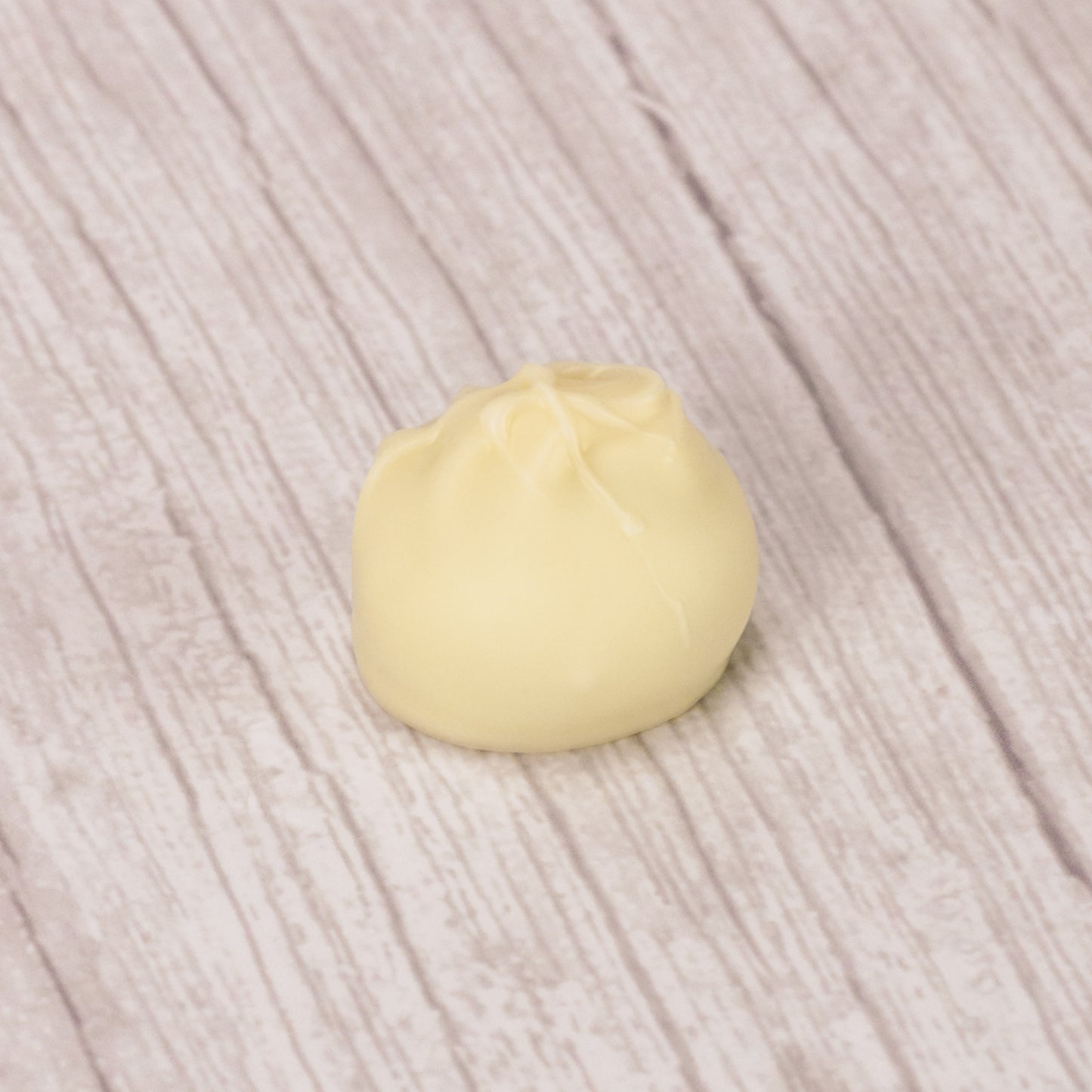 lime flavored cream center covered in white coating in a pound box. Available during the summer
