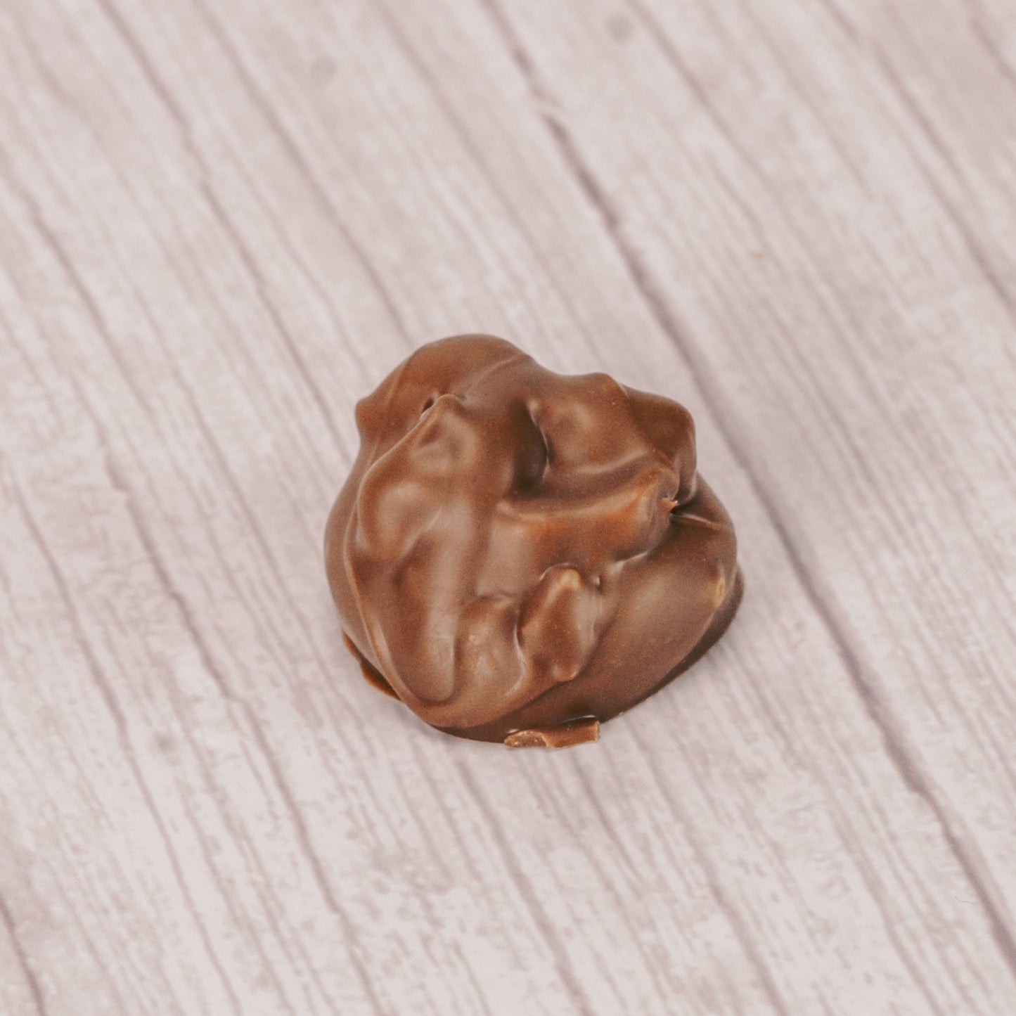 Maple cream topped with peanuts and covered in milk chocolate. One pound box