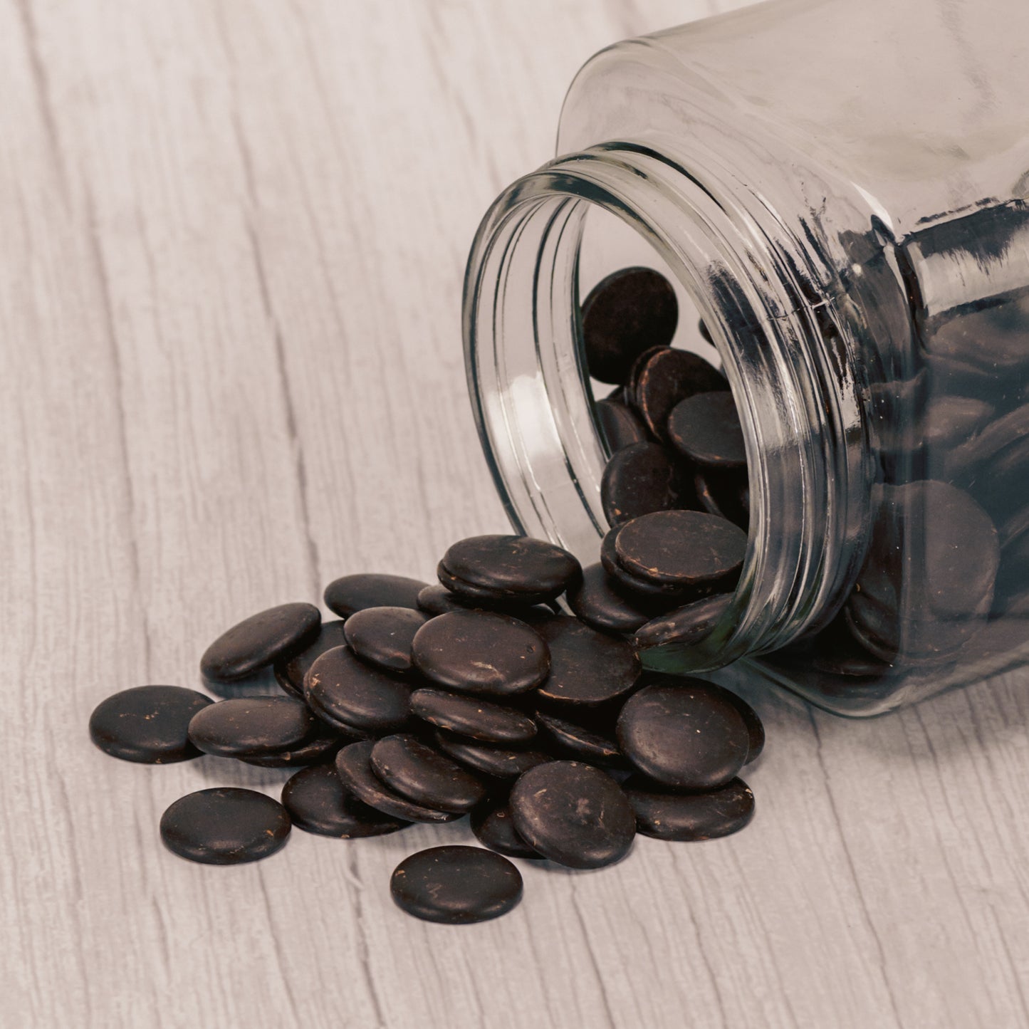 small bite size discs of bittersweet chocolate in a half pound bag