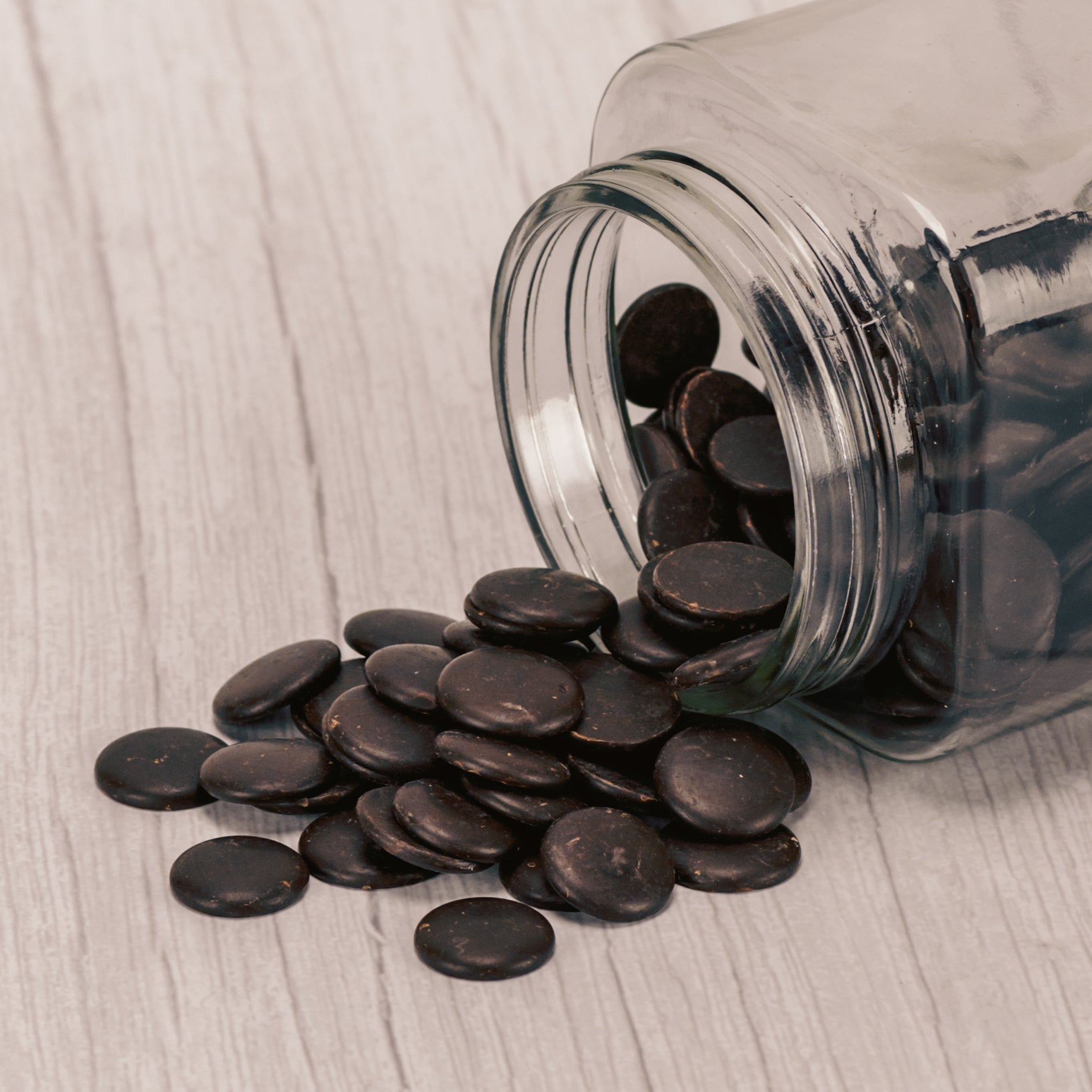 small bite size discs of bittersweet chocolate in a half pound bag