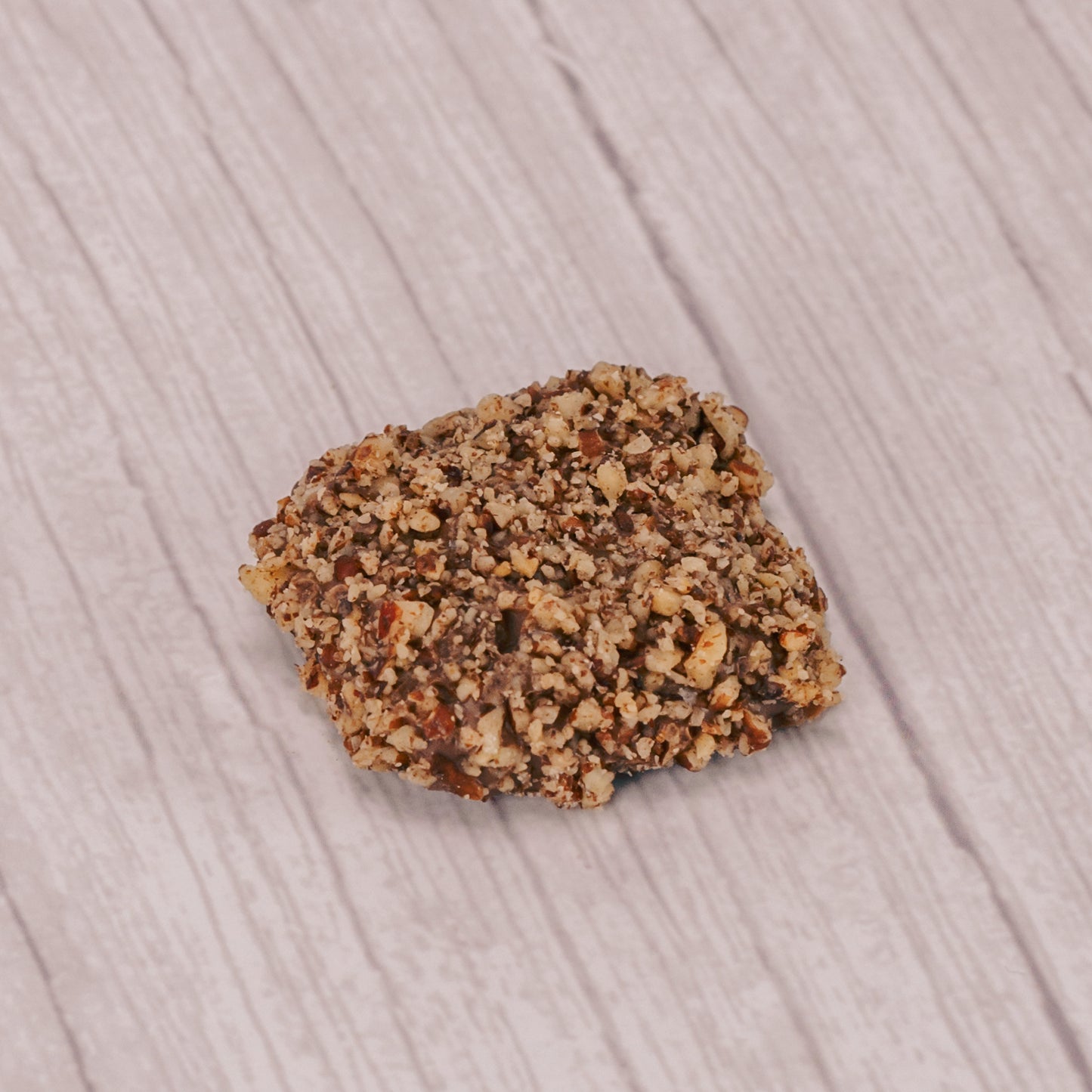 a pound box of butter crunch center (like toffee) covered in milk chocolate and sprinkled with crushed pecans