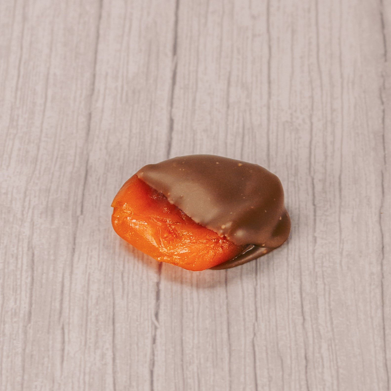Apricot mostly dipped in milk chocolate.