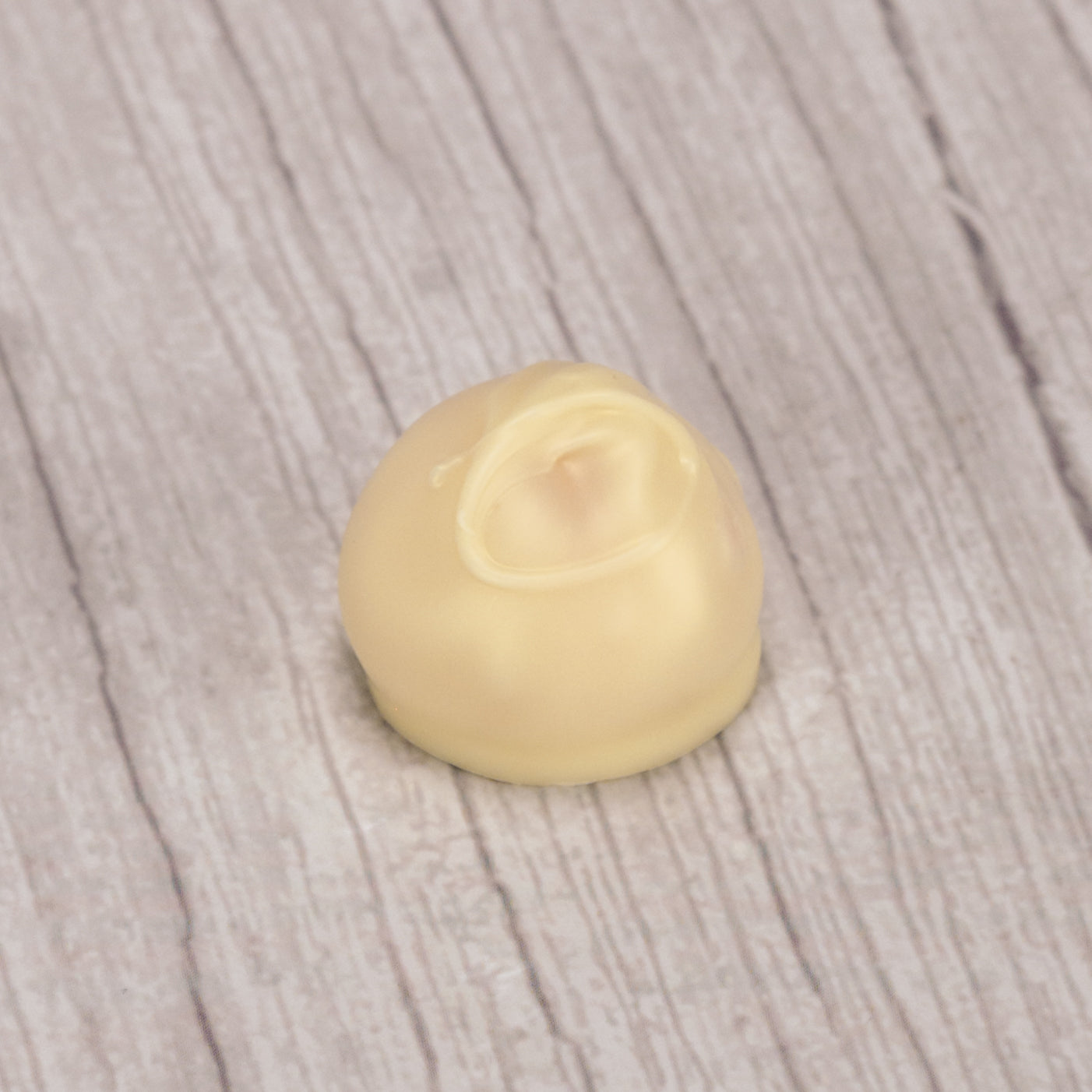 A luscious tangy orange cream center dipped in sweet white coating - a treat only available during the summer.