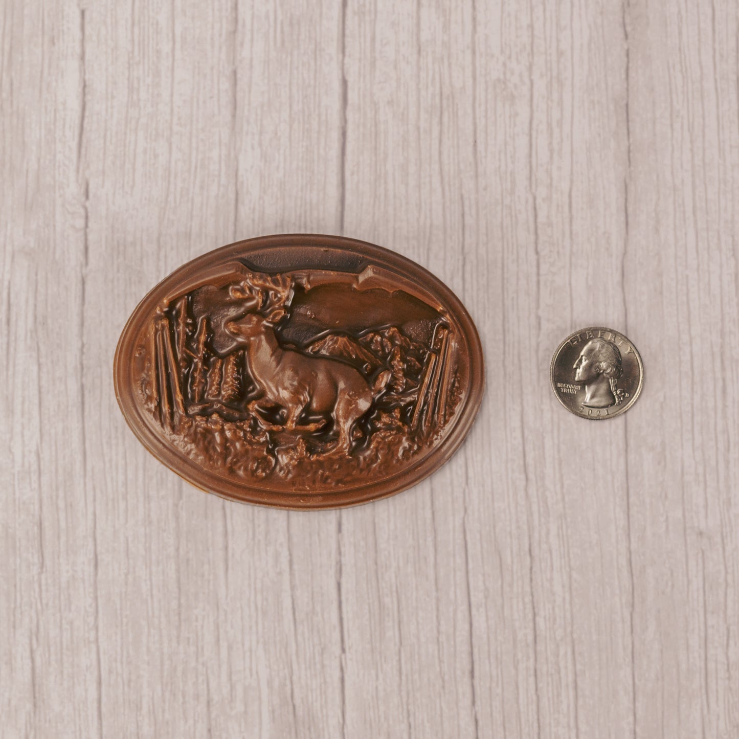 Capture the deer hunter's heart with this oval plaque of a buck deer in the wild made of smooth milk chocolate.