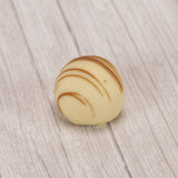 White chocolate with rich undertones of buttery pecans