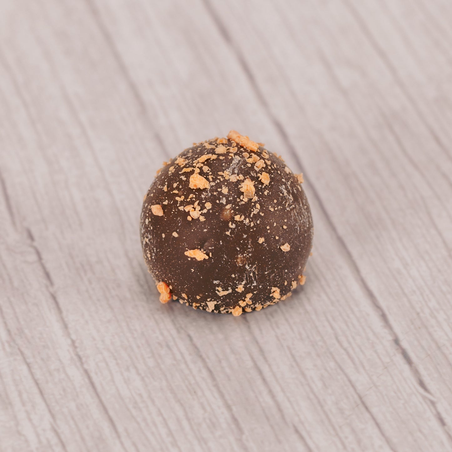 milk chocolate with a citrus orange ganache center, sprinkled with orange sprinkles