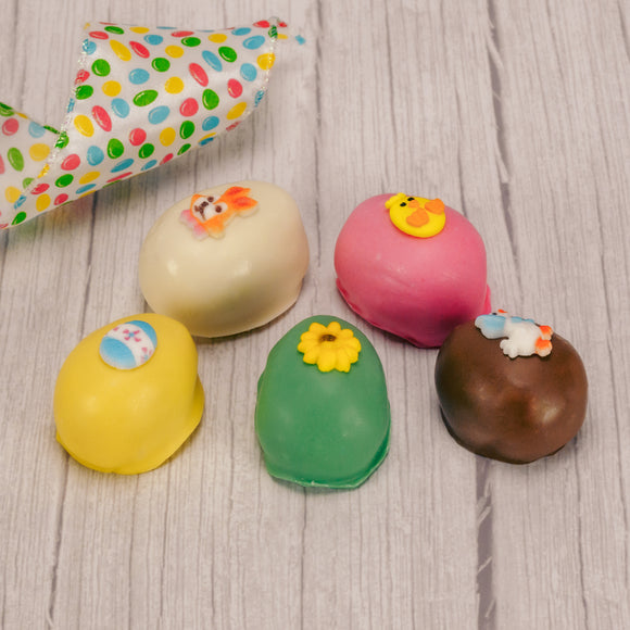 A smaller version of your favorite flavored cream eggs, all hand decorated with assorted Easter icing decorations. Each color egg is a different flavor. Choose from Yellow Coconut Cream, Pink Pecan Cream, Milk Chocolate Chocolate Cream, Green Vanilla Cream or White Peanut Butter Cream.