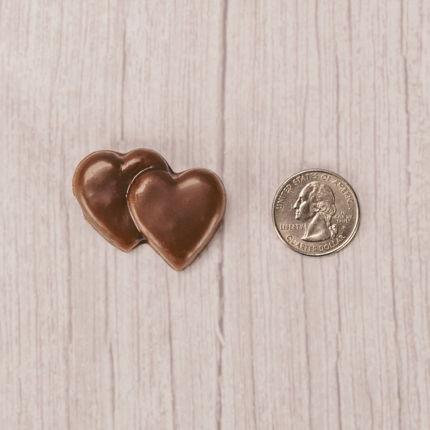 milk chocolate double heart placed in a clear cello bag and sealed. Perfect for a party favor. Bite-sized.