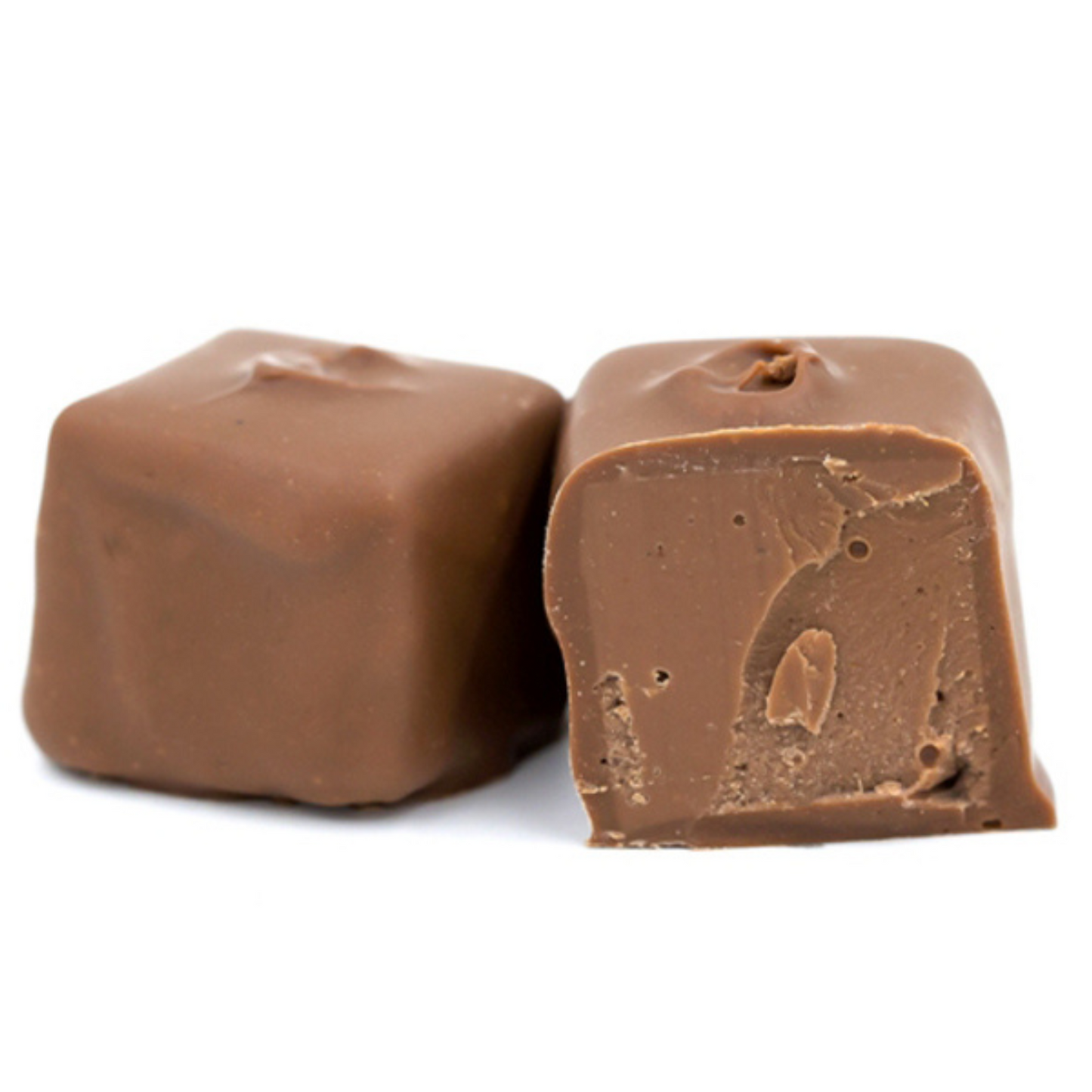 Smooth chocolate center covered in milk chocolate in a pound box.