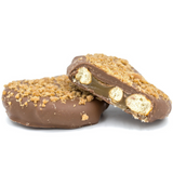 a jumbo pretzel filled with caramel in its' three holes, covered in smooth milk chocolate and sprinkled with crushed butter crunch crumbs.