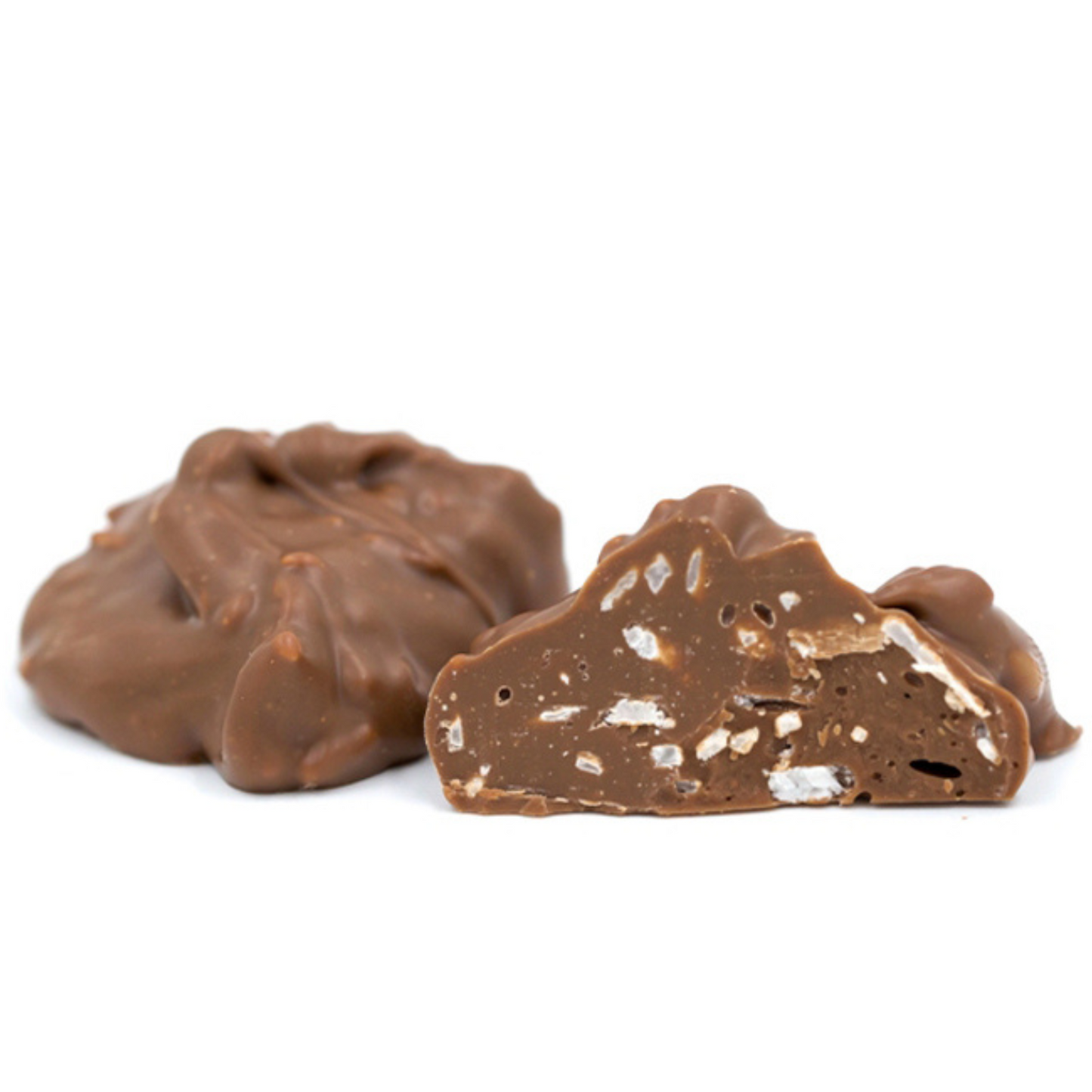 shreds of coconut pieces covered in milk chocolate in a pound box.