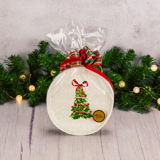 over a half pound of milk chocolate foil bells are packaged with this round hand painted tree dessert plate.
