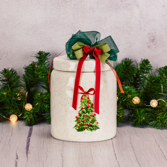 a ceramic hand painted tree cookie jar is filled with some of Marie's sweet cookies like Mint Mint cookies, Oreos, and gingerbread men.