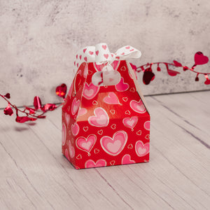 a lovely heart printed box with hearts, that would be perfect for a party favor or small gift. Filled with sweet treats.