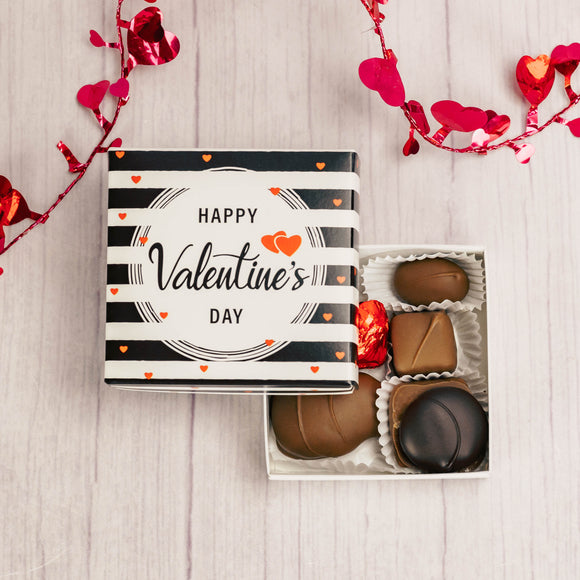 3 oz. of our assorted chocolates in a square box that reads 'Happy Valentine's Day'
