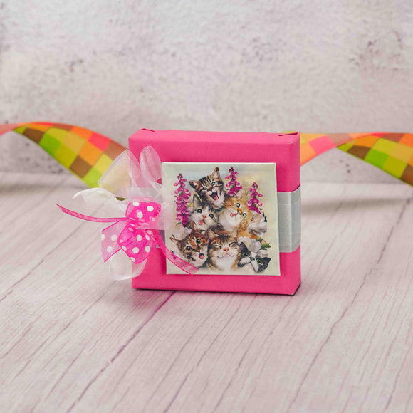 Calling all cat lovers! Stick this square magnet of six cute and silly kittens taking a selfie where you will see it daily! Be sure to enjoy the Sampler box of amazing Assorted Chocolates</strong></a>, first! This gift is topped with a lovely handmade bow, ready to give someone a smile!