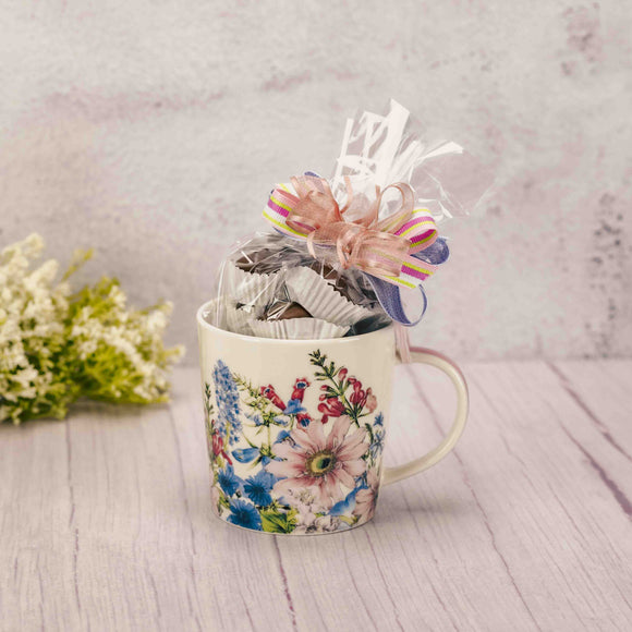 flower mug filled with a half pound of assorted chocolates