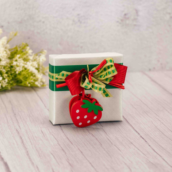  An adorable strawberry kitchen bag clip sits atop a Sampler box of Assorted Chocolates and is wrapped and tied with a lovely handmade bow. Something sweet for all your gift giving occasions this spring!   