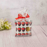 a small zipper pouch that reads 'chocolate is therapy for the soul' is filled with some candy