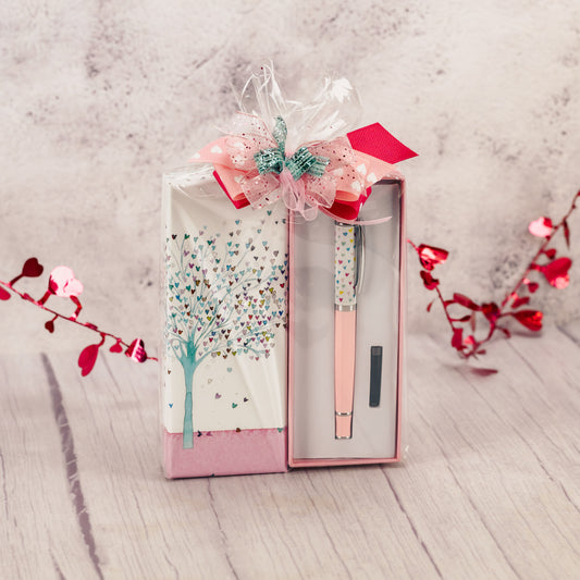 a black fountain ink pen packaged with some Valentine candy. 