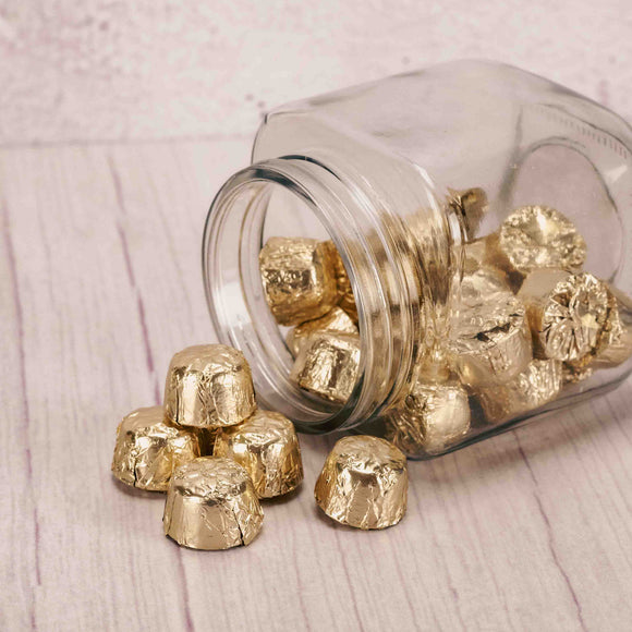A half pound bag of supreme milk chocolate nugget pieces are wrapped in gold foil. 