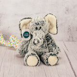 An elephant plush animal with some Easter candy packaged with it