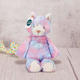 A kitty plush animal with some Easter candy packaged with it