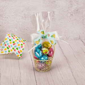 a small wire basket is filled with 3 ounces of milk chocolate foil eggs