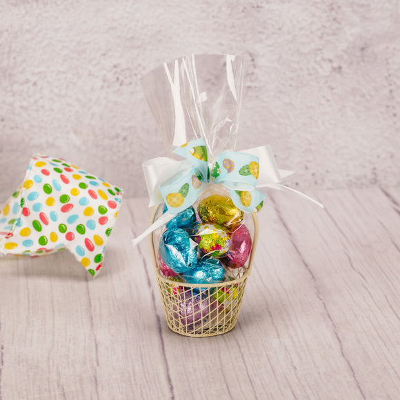 a small wire basket is filled with 3 ounces of milk chocolate foil eggs