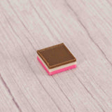 half pound sleeve of milk chocolate, white and pink wafers reflecting the flavors of Neapolitan ice cream!