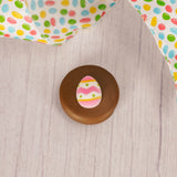 Milk chocolate covered Oreo with an Easter egg sugar decoration on top.