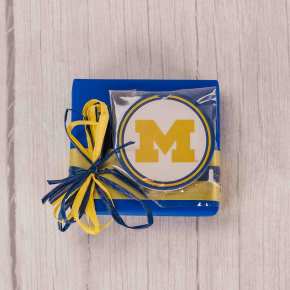 A sampler box of incredible Assorted Chocolates is wrapped in maize and blue for the Wolverine fans. We added a ceramic stone car coaster for an added bonus! The coaster is to absorb moisture and condensation and features a finger notch for easy removal.