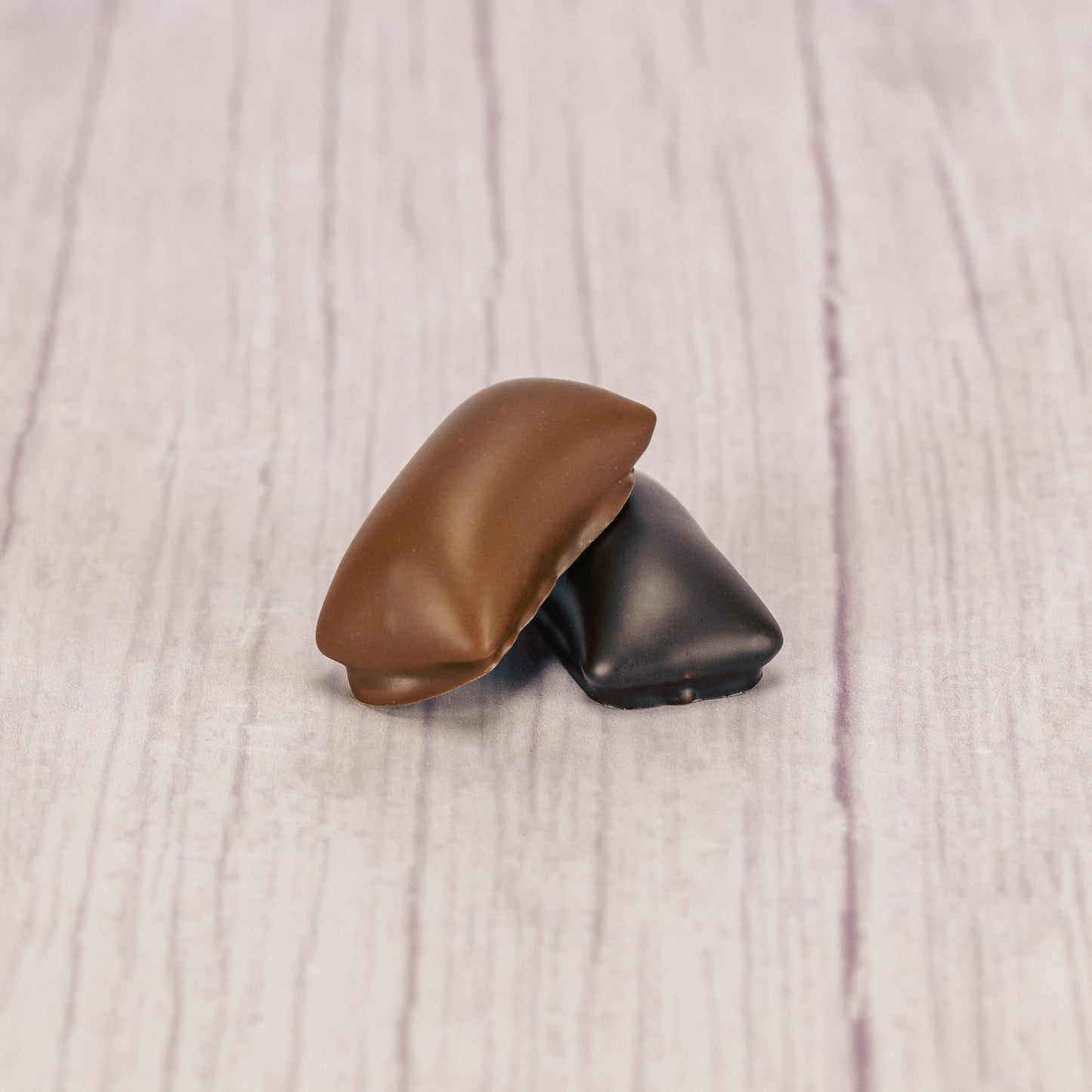 crunchy peanut butter center covered in rich dark chocolate or smooth milk chocolate in a one pound box.