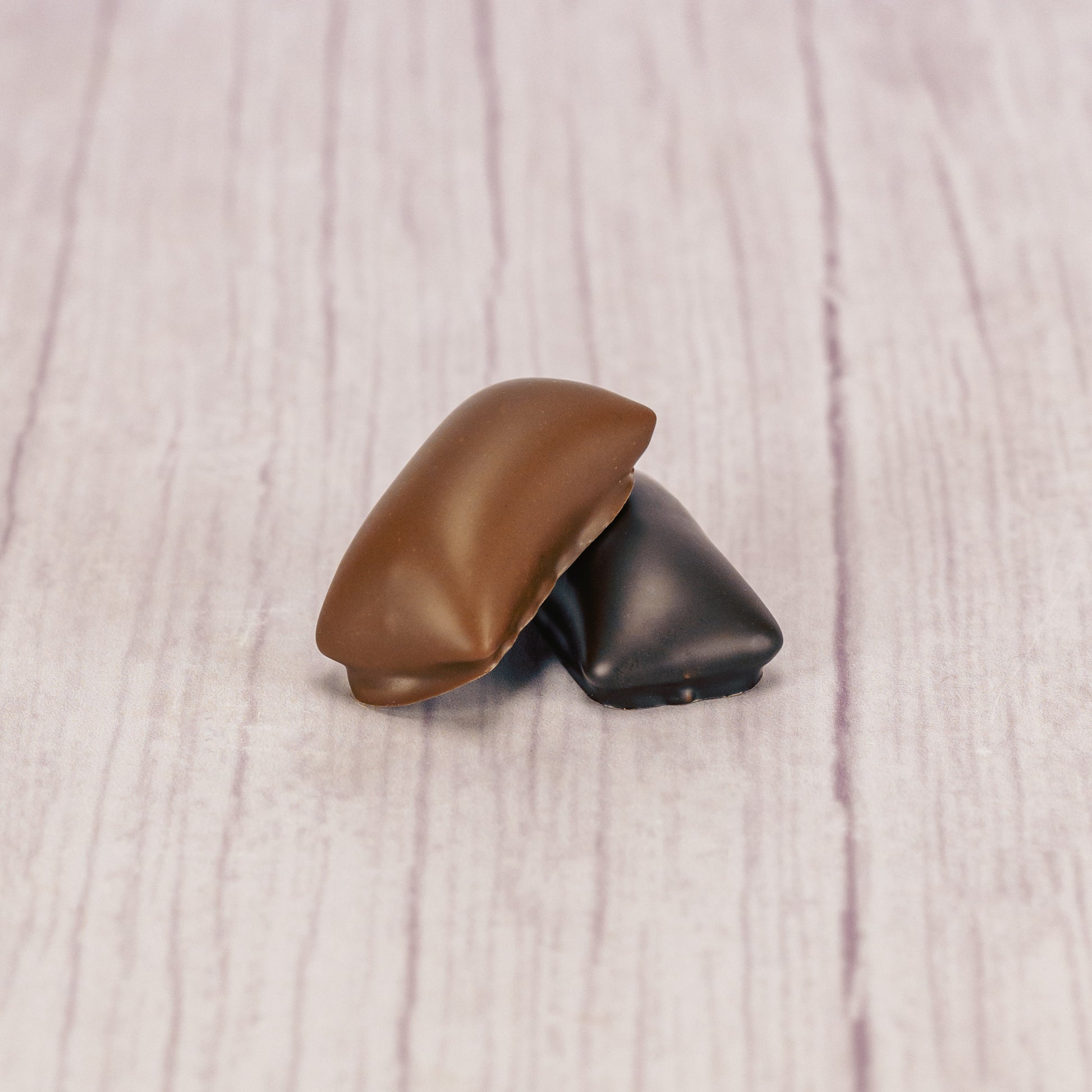 crunchy peanut butter center covered in rich dark chocolate or smooth milk chocolate in a one pound box.