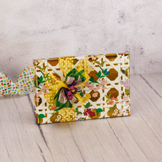 a half pound sugar free assortment is wrapped in spring floral lattice paper and topped with a lovely handmade bow.