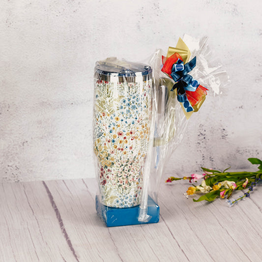 a stainless steel 40 oz. floral travel mug is filled with sweet treats. 