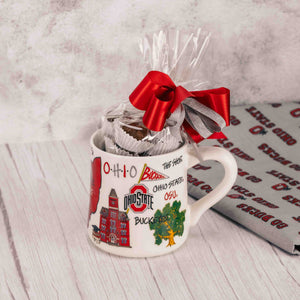 Over a half pound of our sensational Assorted Milk Chocolates is packaged in this unique Ohio State Icon mug that features all things that represent being a Buckeye fan! Tied with a lovely handmade bow on top, fans will appreciate this one!