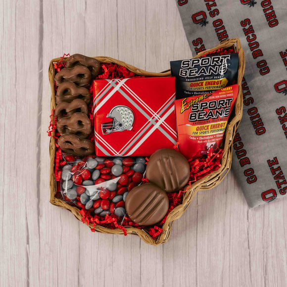 This Ohio shaped wicker basket will delight those who call (or called) Ohio 'home' and are ready to cheer on the Buckeyes! It is filled with tons of favorites that includes:  Jelly Belly Cherry Sport Beans  Jelly Belly Assorted Sport Beans  1.5 oz. Milk Chocolate Pretzels  2 Milk Chocolate Oreos  1/4 lb. Scarlet & Gray M&M's  3 oz.  Buckeyes