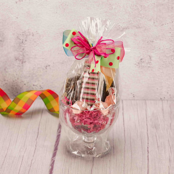 a sundae bowl is packaged with some sweet summer treats