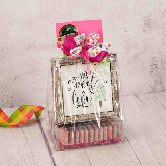 a wood and metal ice cream photo holder that reads 'the sweet life' is packaged with some scrumptious sweet treats