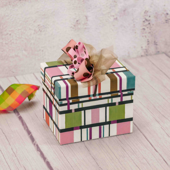 a colorful box is filled with delightful treats