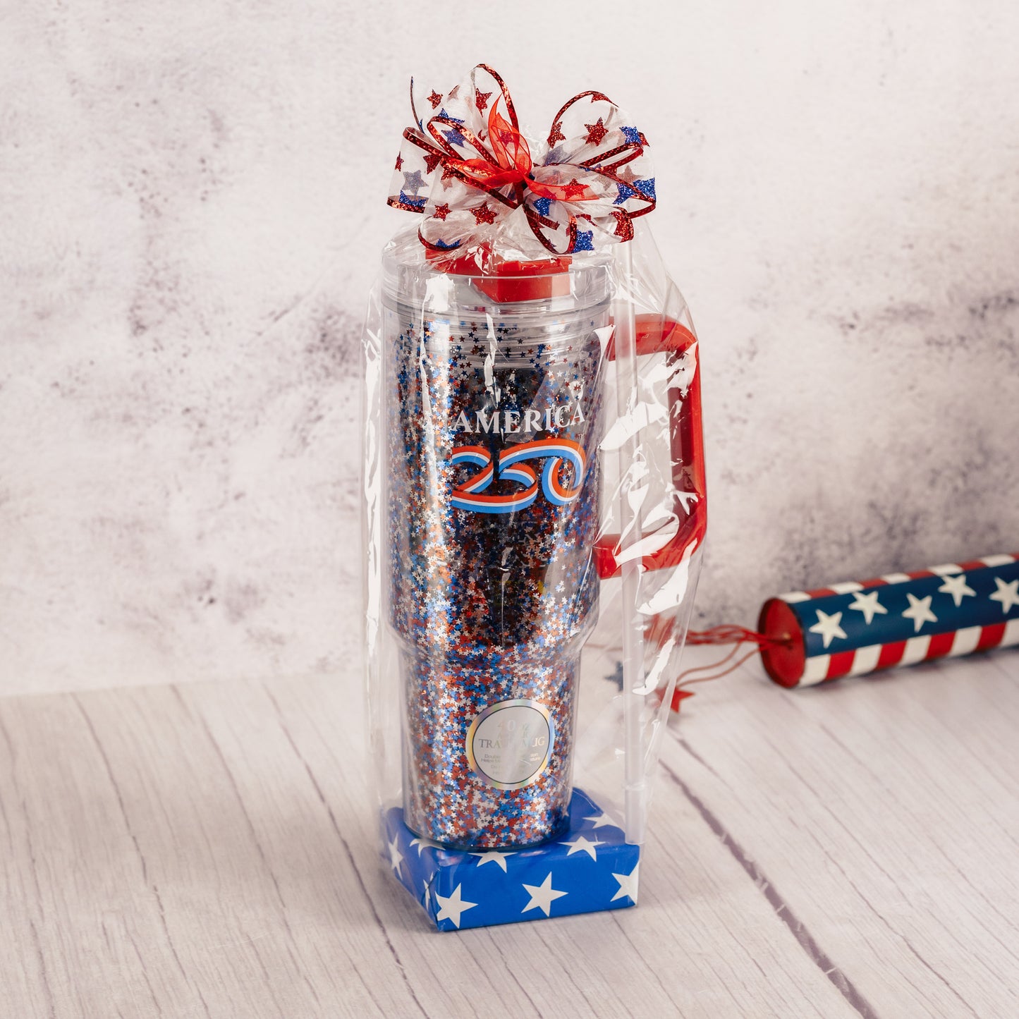 a 40 ounce travel mug that reads America 250 is filled with sweet treats!

