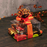 Classic chocolates make this stack a fabulous gift for any fall occasion as it is wrapped in beautiful fall leaf paper and tied with a lovely handmade bow. Tasty treats include:  Fall Jumbo Pretzel  1/4 lb. Milk Chocolate Foil Leaves  1/2 lb. Milk Chocolate Malt Balls  1/2 lb. Milk & Dark Assortment 