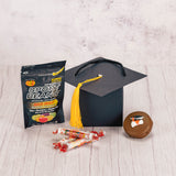 a paper foldable grad cap hat is filled with some sweet treats to celebrate the achievements.