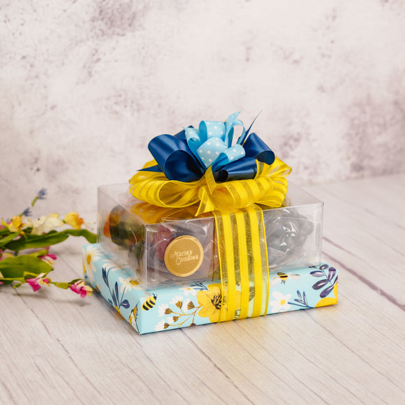 a small spring stack filled with a pound and half of candy is wrapped beautifully and ready for gift-giving