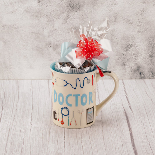 a doctor's mug is filled with a half pound assortment of milk chocolates