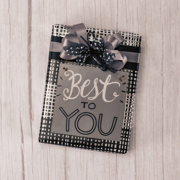 a half pound box of milk assorted chocolates or milk and dark is wrapped and topped with a wooden square ornament that reads 'best to you'