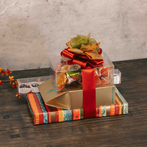 a large fall gift stack with several fall sweet treats