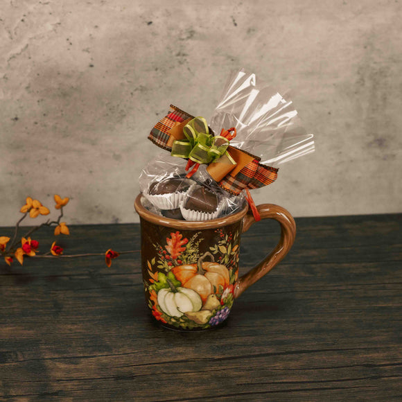 a fall pumpkin mug is filled with a half pound of assorted milk chocolates